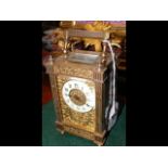 A 15cm high decorative French brass carriage clock