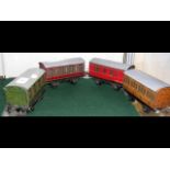 Four Hornby O gauge tinplate carriages