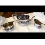 A three-piece silver teaset by Elkington & Co. - B