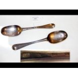 A pair of silver serving spoons by James Mitchells