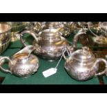 Three piece oriental white metal (tests silver) teaset with signature to base