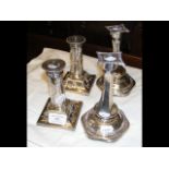 A pair of 16cm high silver candlesticks, together