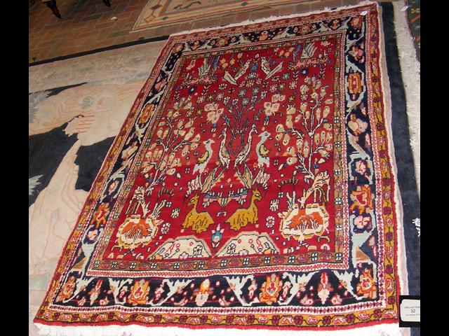 A Persian woollen "Sultanhan" rug with geometric b