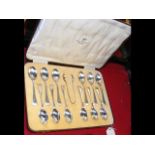 A cased set of twelve silver teaspoons with sugar