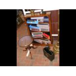 An antique bookcase, together with a wine table an