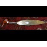 A 57cm long African sword with wooden handle