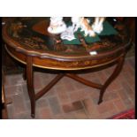 An oval oriental lacquered occasional table