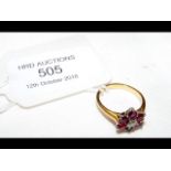 A ruby and diamond ring in 18ct gold setting