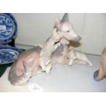 A large Lladro figure of Alsatian with pups - 32cm