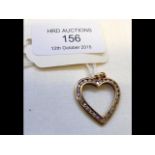 A 9ct gold and diamond heart shaped pendant