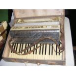 A Soprani Paolo piano accordion in carrying case