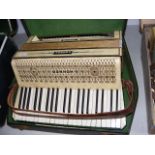A Hohner Verdi III piano accordion in carrying cas