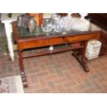 A 19th century library table with drawers to the f