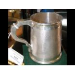 A 9cm high silver tankard with Birmingham hallmark