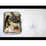A silver cigarette case with printed pictorial dog