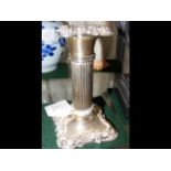 An 11cm high silver candlestick