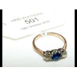 A diamond and sapphire ring