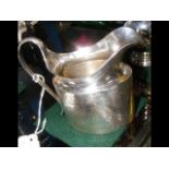 A 10cm high silver cream jug