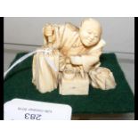 Carved ivory Chinese figure - man working - 5cm hi