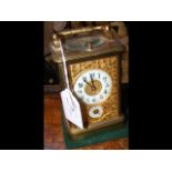 A decorative brass cased repeater carriage clock -