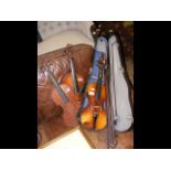 Three old violins, together with a selection of bo