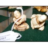 Carved ivory netsuke - man holding scroll, togethe