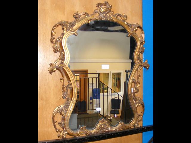 Decorative gilt framed wall mirror