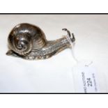 An unusual silver snail ornament with hinged back