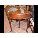 A Georgian oak half round hall table