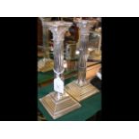 A pair of 25cm high silver Corinthian column candl
