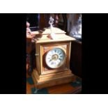 A 40cm high wooden cased striking mantel clock