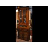 An unusual Victorian walnut bookcase with shaped g