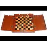 Antique travelling chess set with folding case