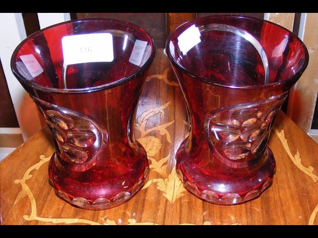 A pair of 32cm high red overlay vases