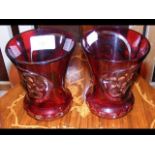 A pair of 32cm high red overlay vases