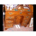 A lady's Georgian mahogany writing desk with cross