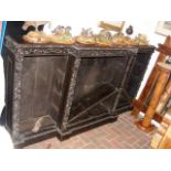 Carved Victorian oak break-front bookcase