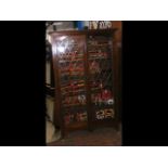 A two door lead glazed display cabinet