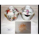 A pair of oriental teacups and saucers with hand p