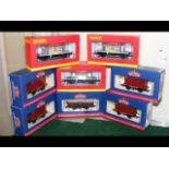 Five boxed Bachmann wagons, together with three bo