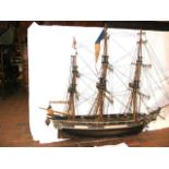 An intricate wooden model of the French ship L'Ast