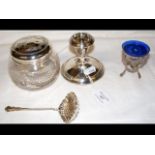 A silver top jar, silver candlestick, etc.