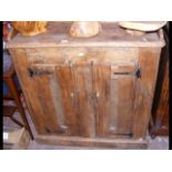 An old pine two door cupboard