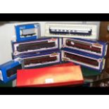 Four boxed Bachmann coaches, together with two Riv