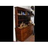 Georgian oak dresser with plate rack over and draw