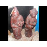 A pair of 82cm high red oriental garden statues