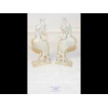 Two carved jade oriental models of Storks in presentation