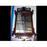 An ornate Georgian style wall mirror - 112cm x 64c