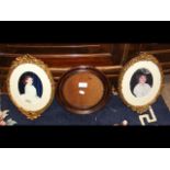 A pair of elegant gilt photo frames and a circular