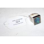 An opal and diamond ring in square 18ct white gold